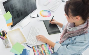 Animation Artist drawing something on graphic tablet at office